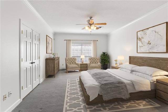 carpeted bedroom with ceiling fan and crown molding