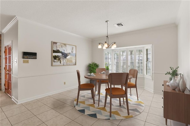 dining space with crown molding, a notable chandelier, a textured ceiling, and light tile patterned flooring