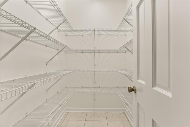 spacious closet with tile patterned flooring