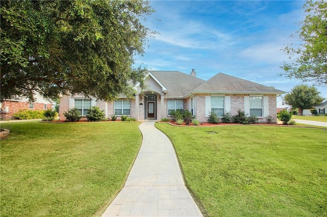 ranch-style home with a front lawn