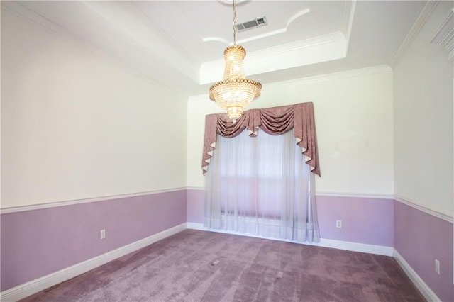 empty room featuring ornamental molding, a notable chandelier, carpet floors, and a raised ceiling