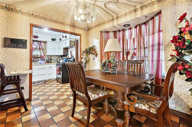 dining room with light tile patterned flooring, an inviting chandelier, and sink