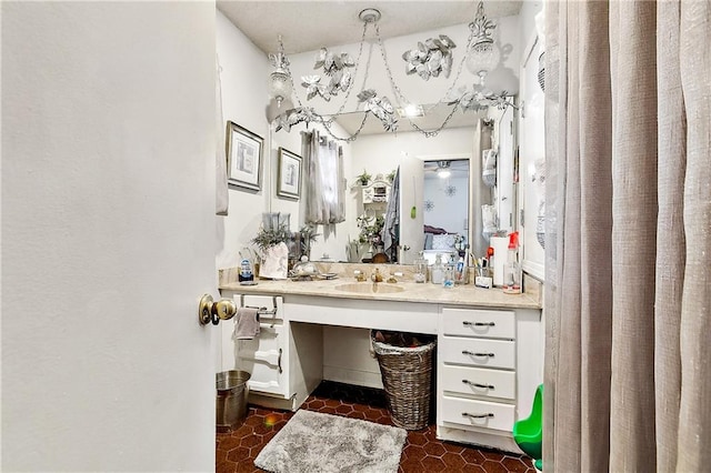 bathroom featuring vanity, ceiling fan, and tile patterned flooring