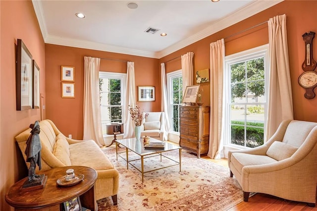 sitting room featuring crown molding and hardwood / wood-style floors