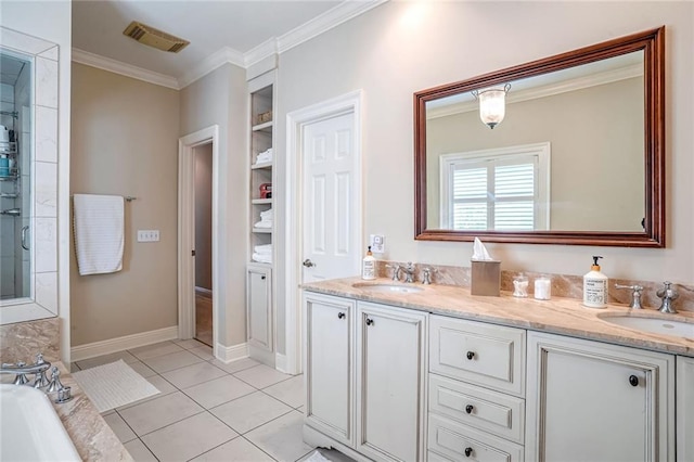 bathroom featuring crown molding, tile patterned floors, a bathing tub, and vanity