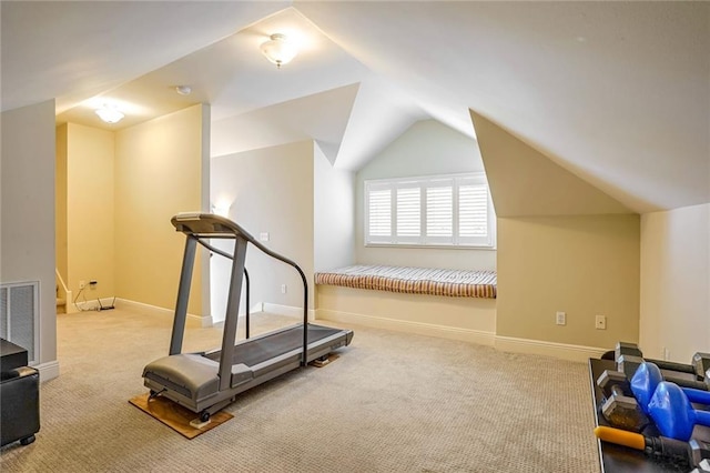 workout area featuring light colored carpet and lofted ceiling