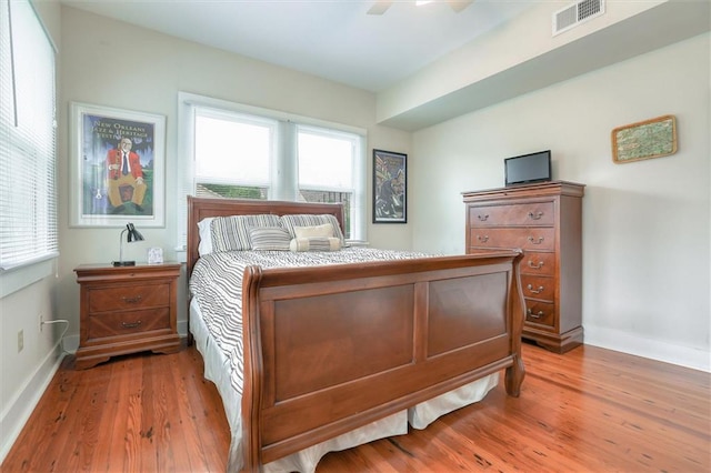 bedroom with wood-type flooring and ceiling fan