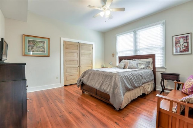 bedroom featuring a closet, ceiling fan, and hardwood / wood-style floors