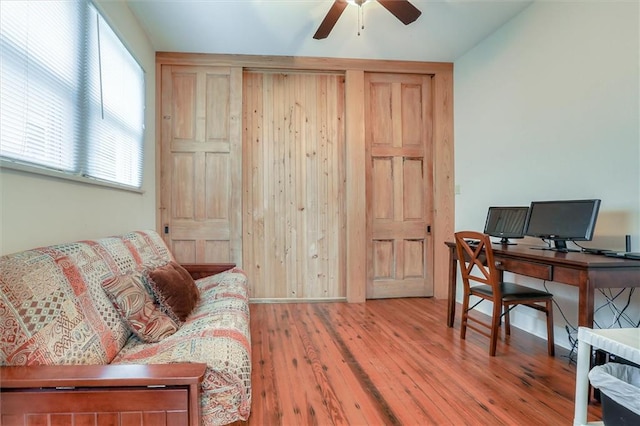 office space featuring wood-type flooring and ceiling fan