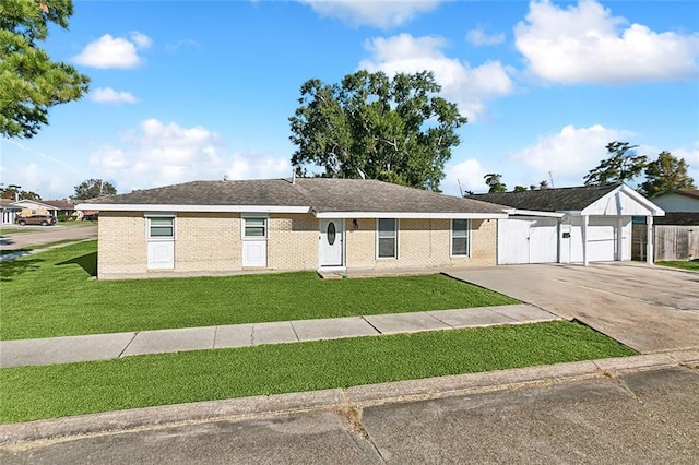 ranch-style house with a front yard and a garage