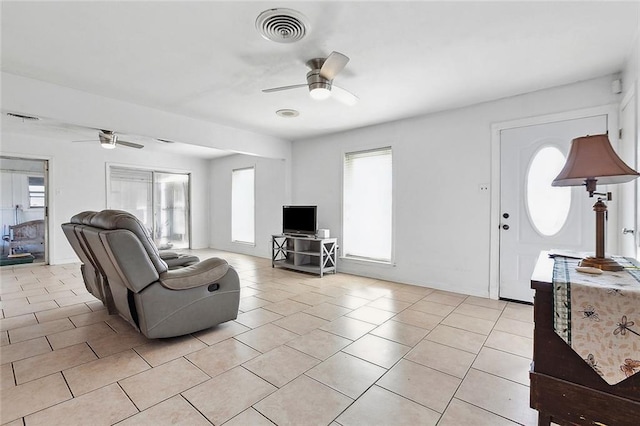 1005 35 Th St, Gretna, LA 70053 - living room featuring visible vents, a ceiling fan, plenty of natural light, and light tile patterned flooring