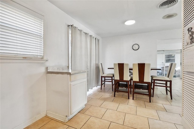 1005 35 Th St, Gretna, LA 70053 - dining space with light tile patterned floors, baseboards, plenty of natural light, and visible vents