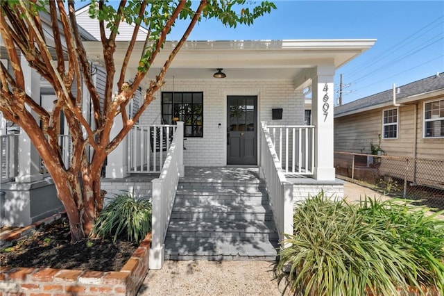 doorway to property featuring a porch