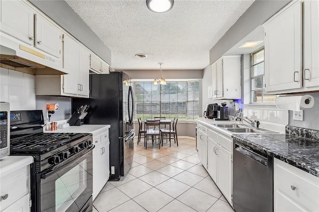 kitchen featuring black appliances, white cabinetry, and sink