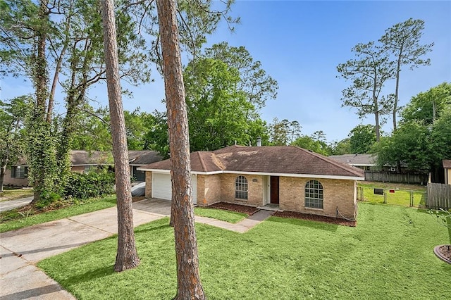 ranch-style home with a garage and a front lawn