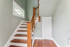 stairs with hardwood / wood-style floors