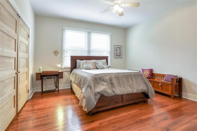 5612 Woodlawn Pl, New Orleans, LA 70124 - bedroom with hardwood / wood-style floors, baseboards, and ceiling fan