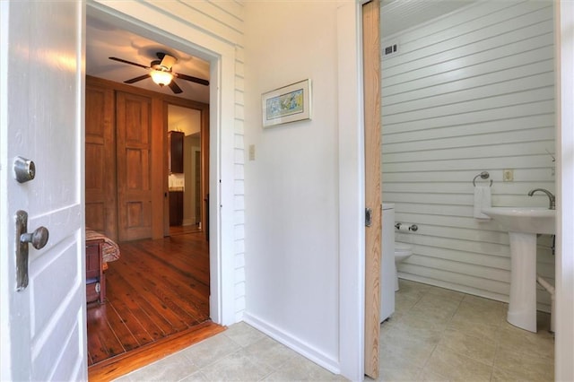 5612 Woodlawn Pl, New Orleans, LA 70124 - bathroom with toilet, a ceiling fan, and tile patterned flooring