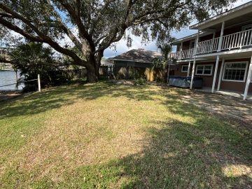 view of yard with a balcony