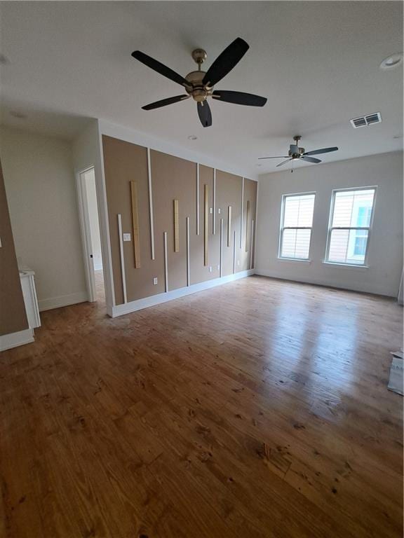 unfurnished room featuring wood-type flooring and ceiling fan