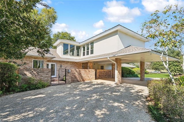 view of front of property featuring a carport