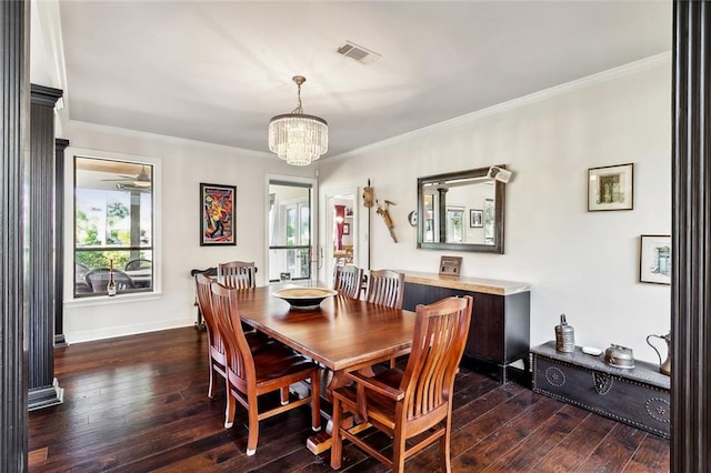 dining room with crown molding, a chandelier, and dark hardwood / wood-style flooring