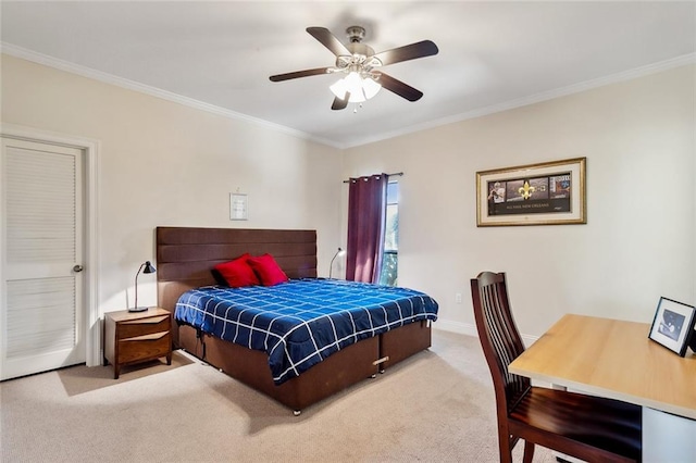 carpeted bedroom with ceiling fan and crown molding