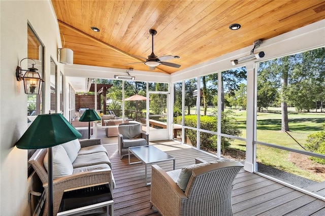 sunroom / solarium featuring lofted ceiling, wood ceiling, and ceiling fan