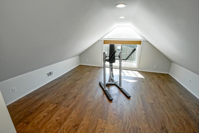 bonus room featuring lofted ceiling and dark wood-type flooring