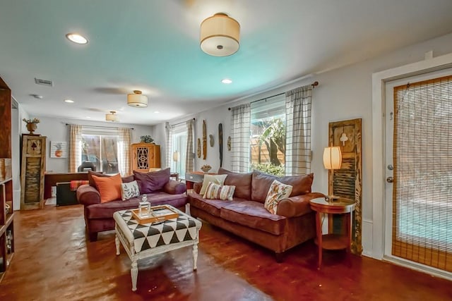 living room featuring concrete floors