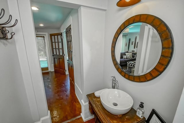 bathroom featuring vanity and concrete flooring