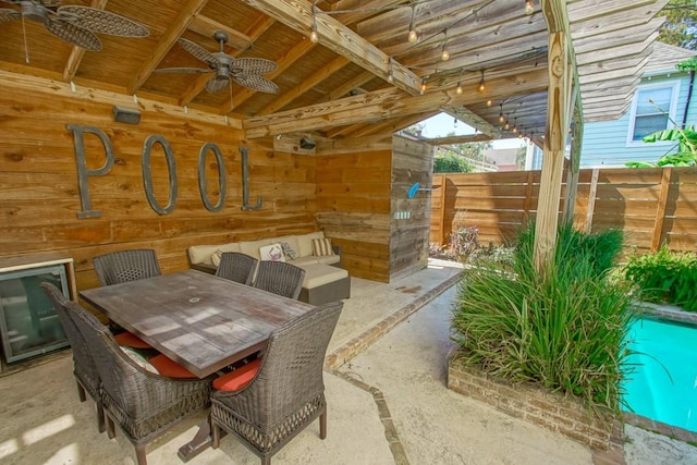 dining area with ceiling fan and lofted ceiling