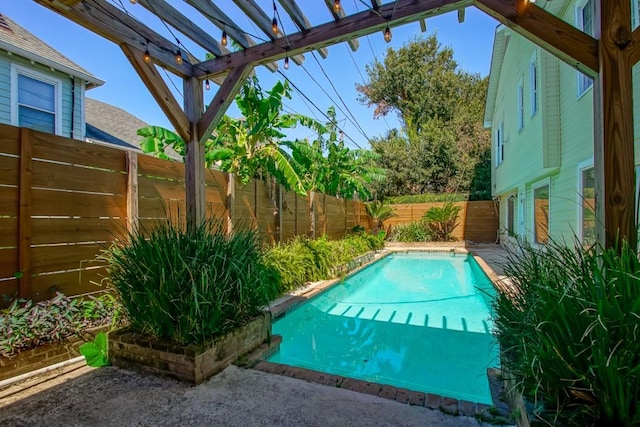 view of swimming pool with a pergola