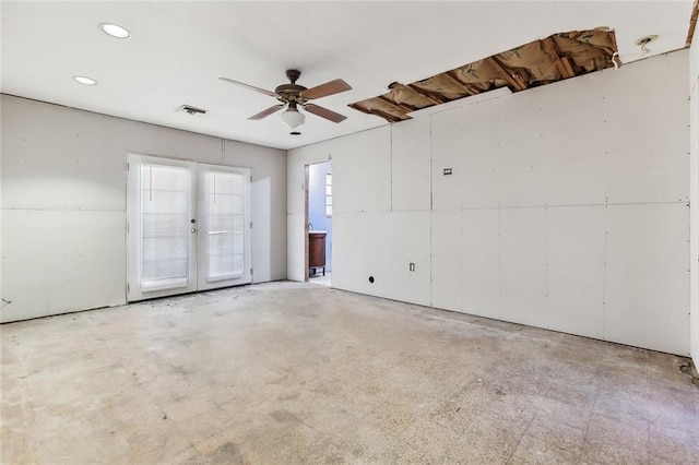 unfurnished room with french doors and ceiling fan