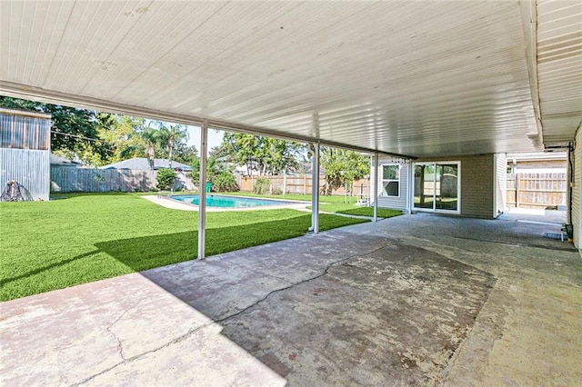 view of patio with a fenced in pool