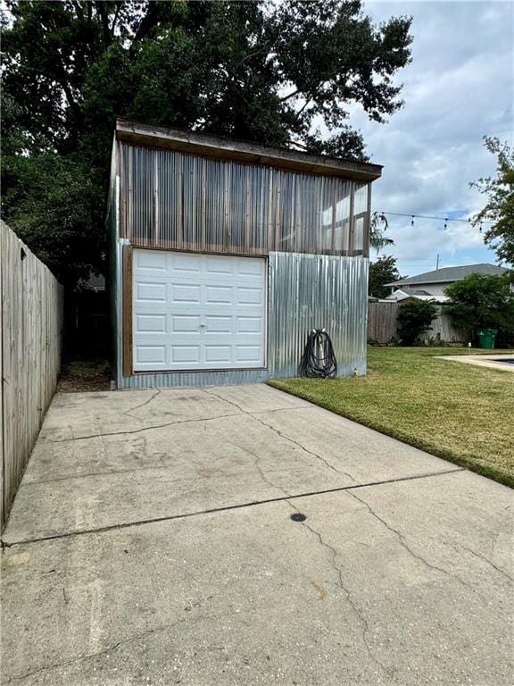 garage featuring a yard