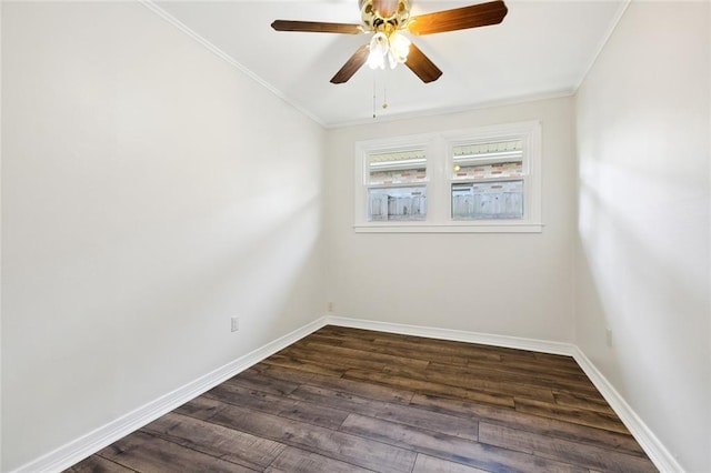 spare room featuring ornamental molding, dark wood-type flooring, and ceiling fan