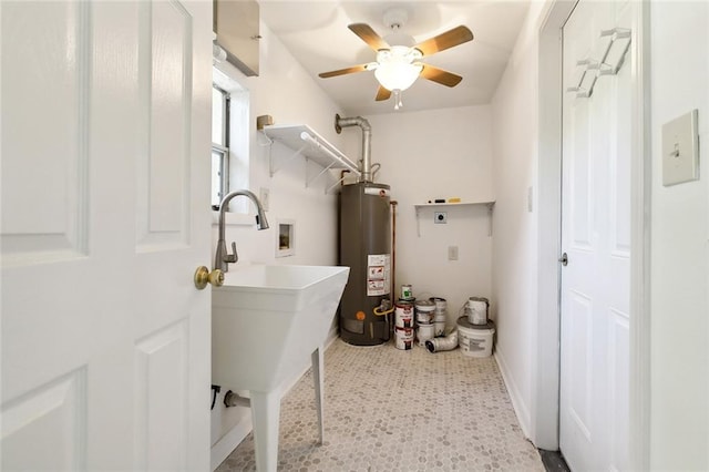 washroom with hookup for an electric dryer, ceiling fan, washer hookup, and gas water heater