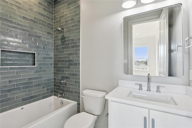 full bathroom featuring vanity, toilet, and tiled shower / bath combo