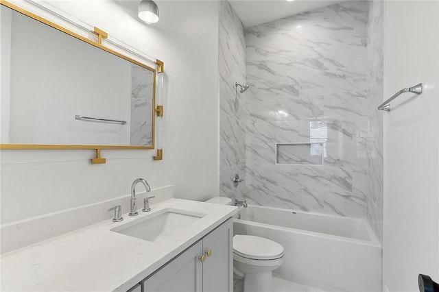 full bathroom featuring vanity, toilet, and tiled shower / bath