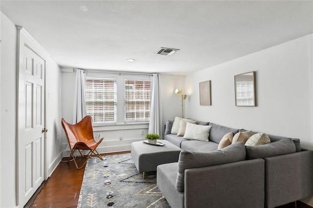 living room with dark hardwood / wood-style flooring