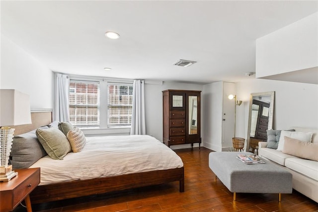 bedroom featuring dark hardwood / wood-style flooring