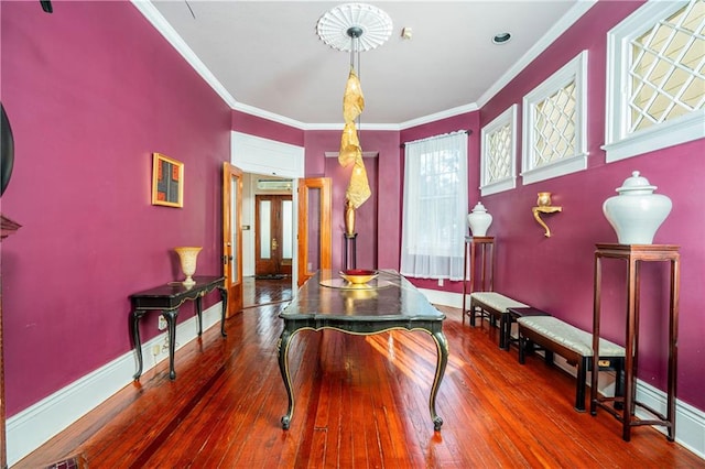 miscellaneous room featuring ornamental molding and hardwood / wood-style flooring