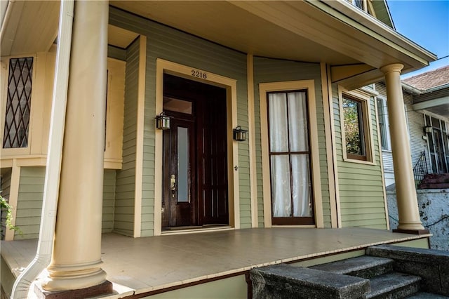 doorway to property with covered porch