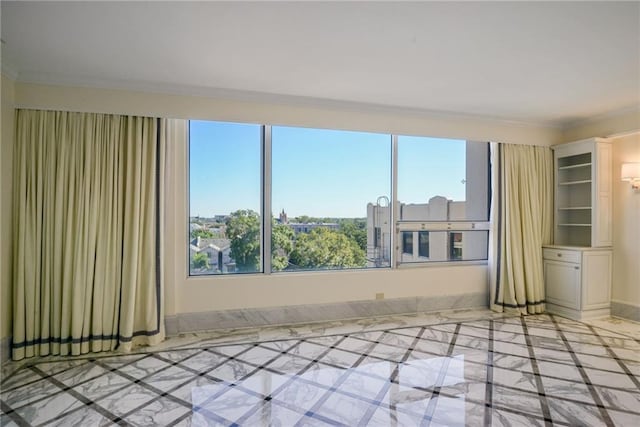 unfurnished room featuring ornamental molding