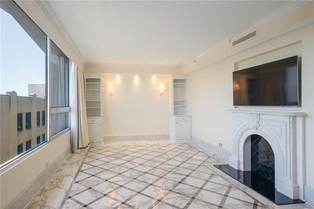 unfurnished living room with crown molding and built in shelves