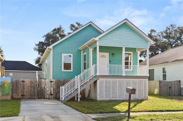 bungalow-style home featuring a front yard and a porch