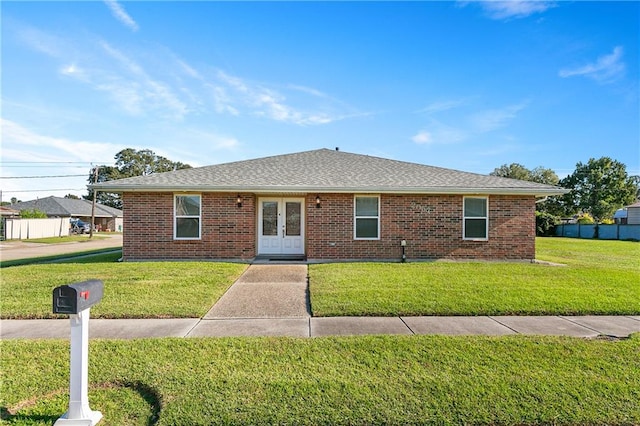 ranch-style house with a front lawn