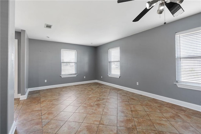 unfurnished room featuring light tile patterned flooring and ceiling fan