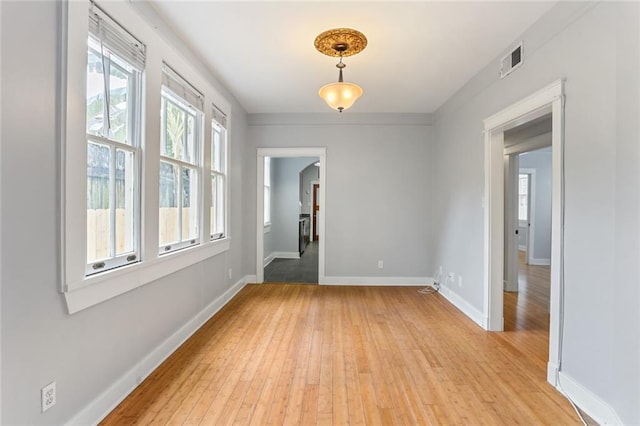 unfurnished room featuring light hardwood / wood-style floors